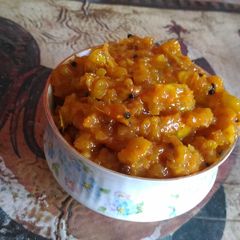 A picture of Grated raw mango pickle.