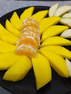 Una foto de Ensalada de mango, pera y mandarina