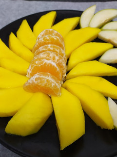 Una foto de Ensalada de mango, pera y mandarina