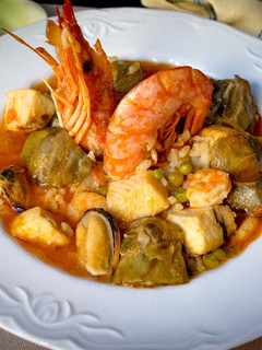 Una foto de Arroz caldoso con abadejo y alcachofas