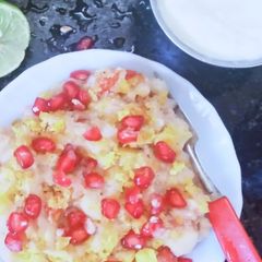A picture of Potato chat with yogurt and tamarind chutney.