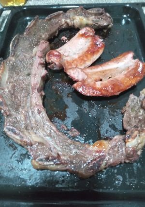 Una foto de Asado y Chorizos al horno