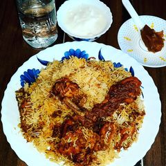 A picture of Chicken Biriyani with chicken chap.