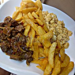 A picture of Chips, liver sauce n scrambled egg.