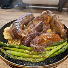 A picture of Toad in the hole & Onion Gravy.