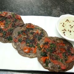 Falahari Tomato Uttapam A picture of Falahari Tomato Uttapam.
