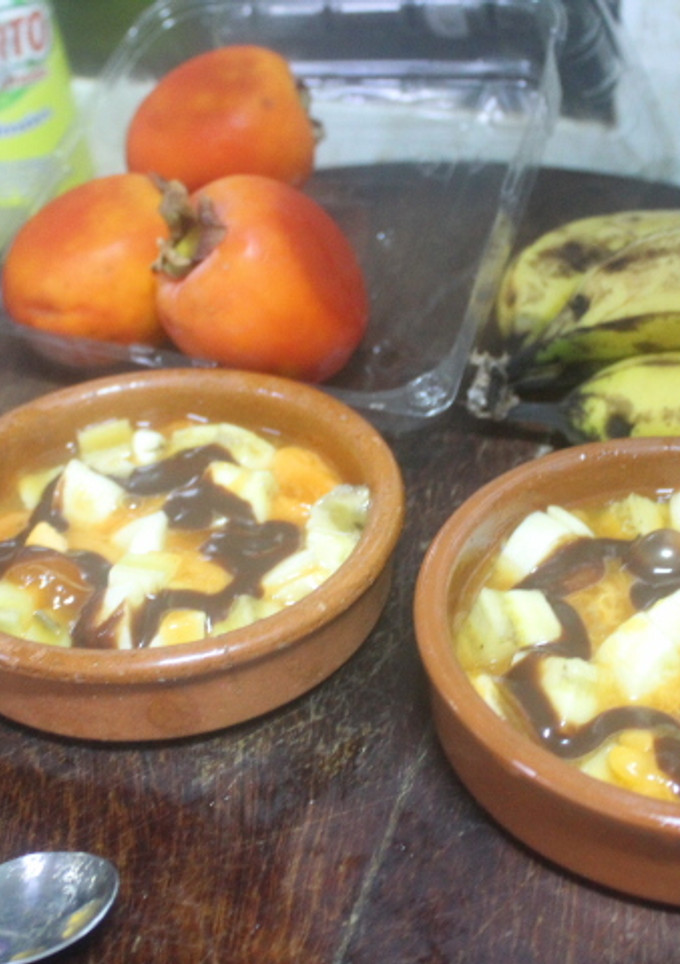 Una foto de Palo santo con plátano y sirope de chocolate