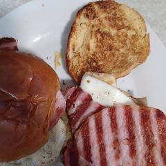 A picture of Grilled Bacon, Potato Scone and Fried Egg Bap.