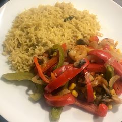 A picture of Mushroom and prawn stir fry with noodles.