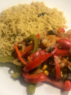 A picture of Mushroom and prawn stir fry with noodles.