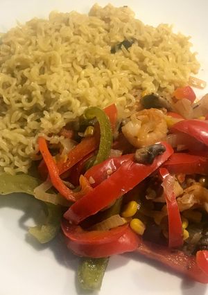 A picture of Mushroom and prawn stir fry with noodles.