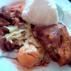 A picture of Ugali with Fried beef and steamed Cabbage.