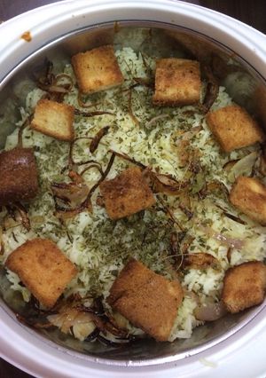 A picture of Saffron vegetable Pullav with Onion Raita.