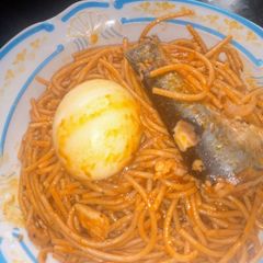 A picture of Fish Jollof spaghetti with egg 🍝😋.