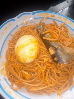 A picture of Fish Jollof spaghetti with egg 🍝😋.