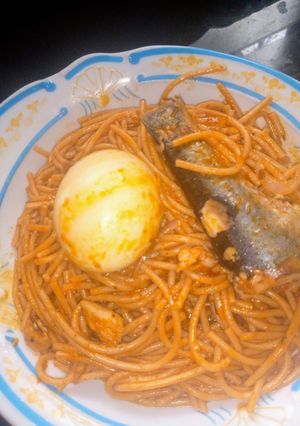 A picture of Fish Jollof spaghetti with egg 🍝😋.