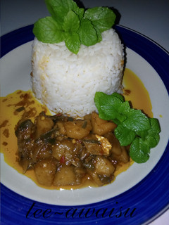 A picture of White rice with potatoes sauce.
