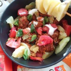 A picture of Fried meat with vegetables.