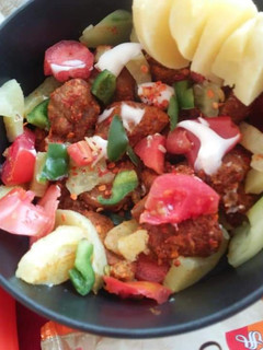 A picture of Fried meat with vegetables.
