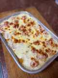 Puré de papa gratinado con cherrys, cebolla y ajo