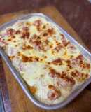 Puré de papa gratinado con cherrys, cebolla y ajo