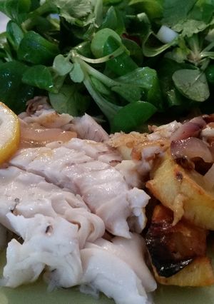 A picture of Fish with roasted vegetables.