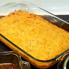 A picture of Seasoned and cheesy smashed potatoes.