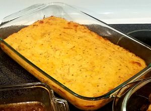 A picture of Seasoned and cheesy smashed potatoes.
