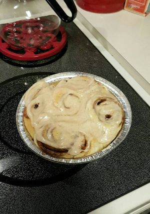 A picture of TL'S pudding Cinnamon Rolls with cream cheese.