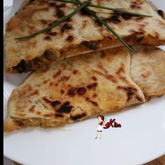 A picture of Cheesy Mushroom Paratha.