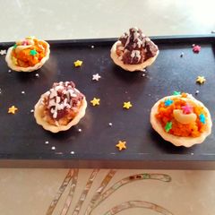 A picture of Tart filled with cake, chocolate & carrot halwa.
