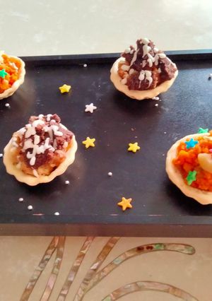 A picture of Tart filled with cake, chocolate & carrot halwa.