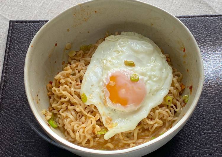 Recipe of Favorite Jah Jan Mien (instant packet noodles) with peanut butter, spring onions topped with fried egg