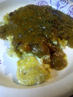 A picture of Bacon curry sauce on eggs.