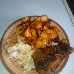 A picture of Plantain,fried egg with fried river fish.
