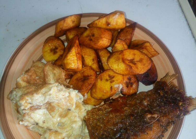 Plantain,fried egg with fried river fish