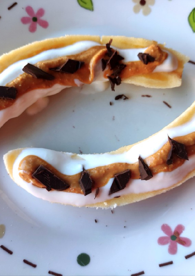 Una foto de Banana split 🍌🍫🥜