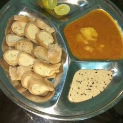 A picture of Fara with peanut's chutney & aloo curry.