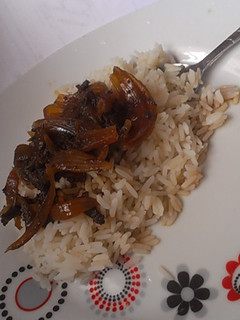 A picture of White rice with onion and minced meat sauce.