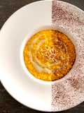 RISOTTO DI ZUCCA, CREMA AL GORGONZOLA NOCCIOLE TOSTATE E POLVERE DI CACAO