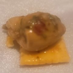 A picture of Sweet Soy Spiced Oyster on White Cheddar Cracker.