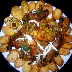 A picture of Spicy baked potatoes and peppered chichen.