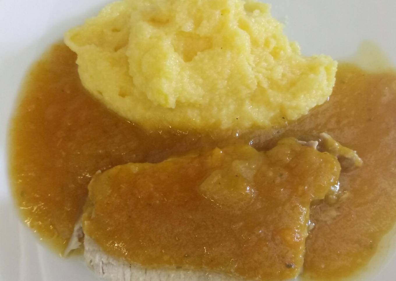 Roast pork with apple gravy served with polenta