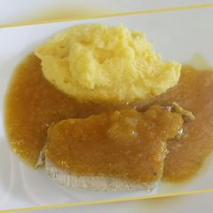 Roast pork with apple gravy served with polenta A picture of Roast pork with apple gravy served with polenta.