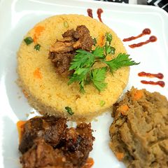 A picture of Buttered couscous and onion sauce.