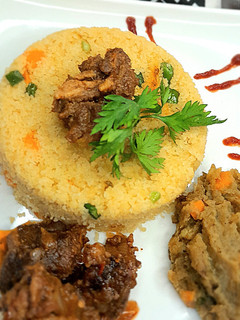 A picture of Buttered couscous and onion sauce.
