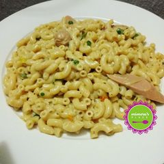 A picture of Creamy and delicious pasta Alfredo with mini hot dogs.