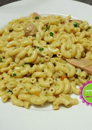 A picture of Creamy and delicious pasta Alfredo with mini hot dogs.