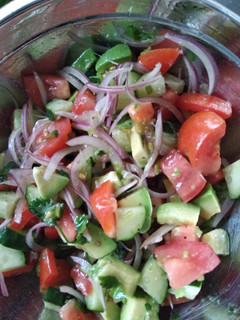 A picture of Cucumber tomato avocado salad.