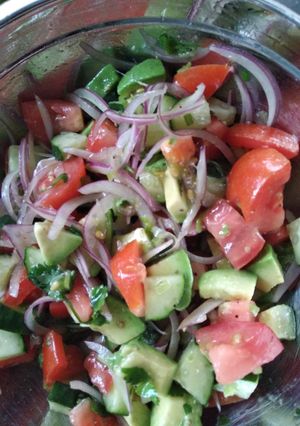 A picture of Cucumber tomato avocado salad.